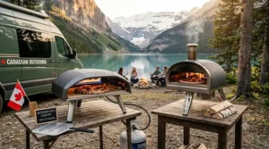 A portable Gozney Roccbox pizza oven set up at a lakeside campsite in Canada.