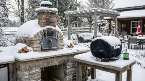 Detailed comparative photograph of a digital thermometer reading 950°F (500°C) and an analog built-in thermometer reading 800°F (425°C) for heat soak, set on a stone patio with portable and permanent ovens in the background.