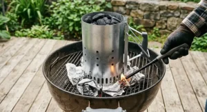 Step by step illustration on how to light a charcoal chimney starter under 40 CAD using crumpled newspaper underneath.