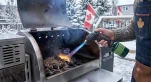 Using a powerful propane torch lighter for grilling to ignite wood pellets and charcoal briquettes for clean outdoor barbecue cooking.